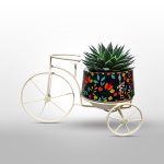 Vintage-inspired design of the cycle pot adds character and charm to any garden setting