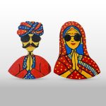 Fridge magnet featuring stylish couple in traditional outfits, each sporting a pair of funky goggles